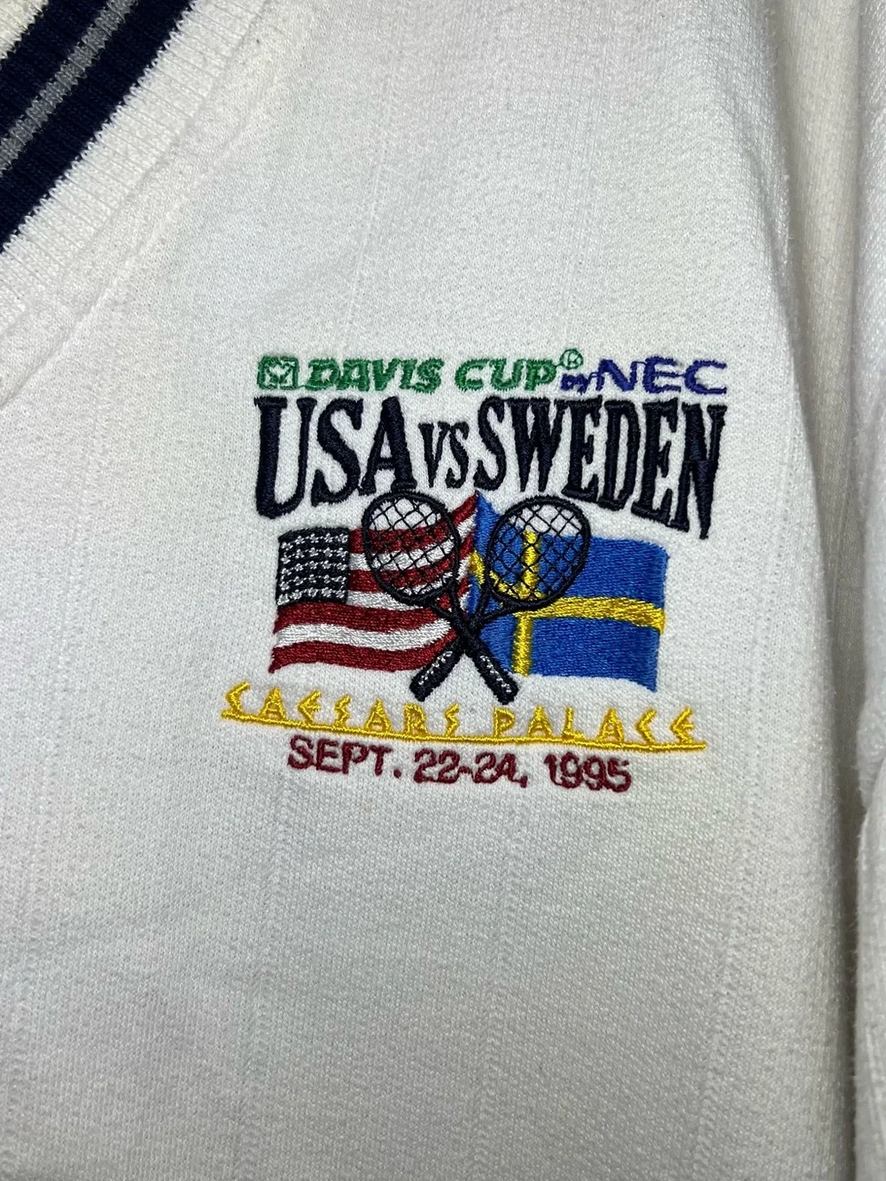 1995 Vintage Mens White V‑Neck Striped Trim Sweater - USA vs Sweden Graphic